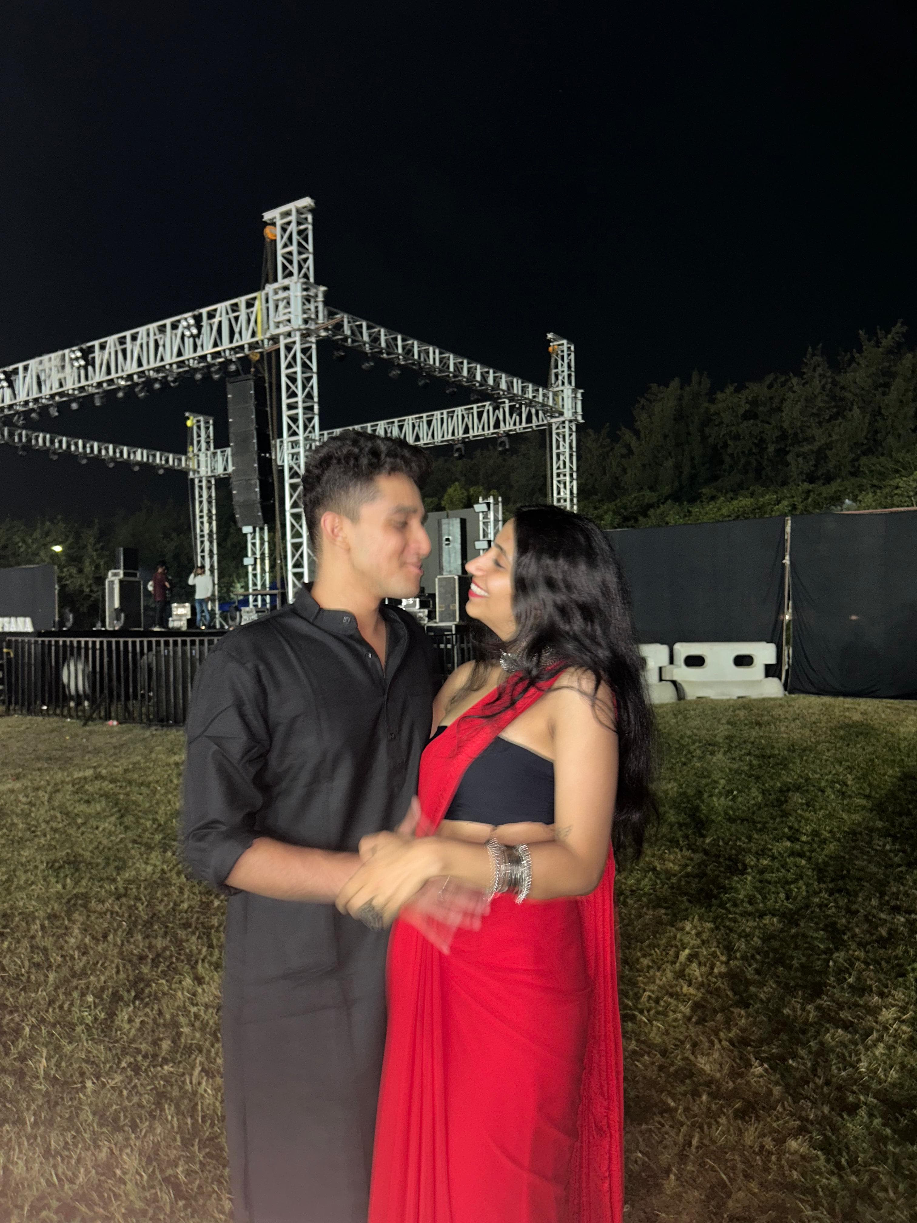 Together at a concert under the night sky