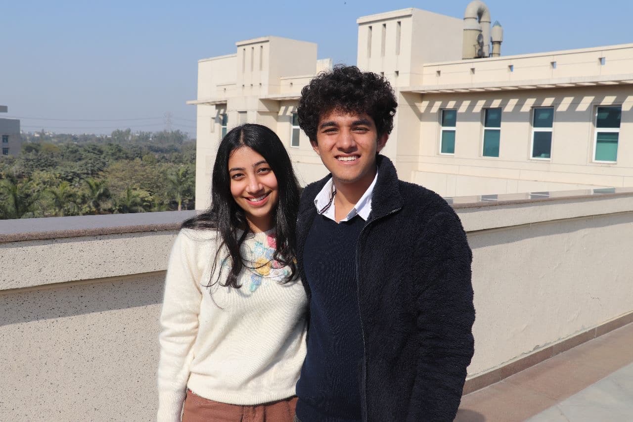 Smiling together on a rooftop